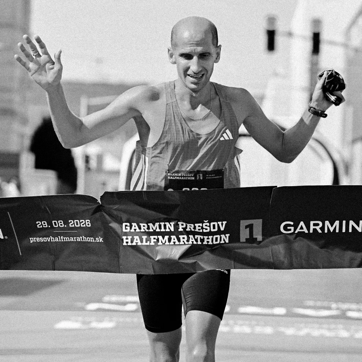 Runner celebrating at the finish line of the Garmin Prešov Halfmarathon 2026
